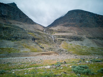 Scenic view of landscape and mountains against sky