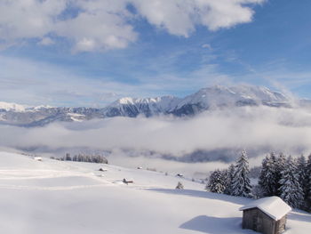 Scenic view of snowcapped mountains against sky