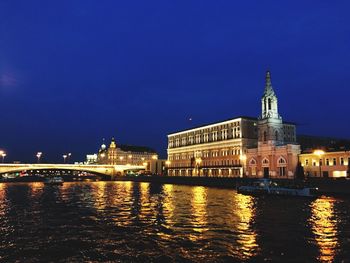 Illuminated buildings at waterfront