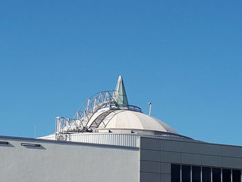 Low angle view of building against blue sky