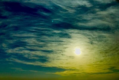 Low angle view of moon at sunset