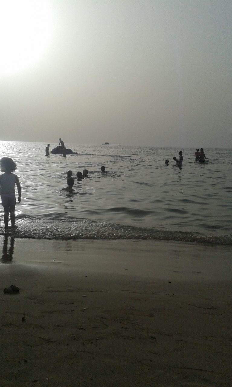 sea, beach, horizon over water, water, shore, sand, leisure activity, lifestyles, men, vacations, sky, large group of people, enjoyment, scenics, medium group of people, beauty in nature, nature, tranquility, wave