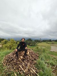 Portrait of man on field against sky