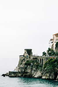 Buildings on rocky coastline  with diminishing perspective