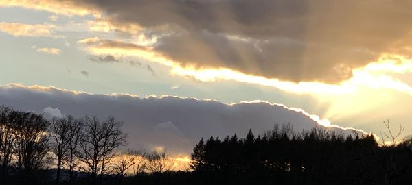 Scenic view of silhouette mountains against sky at sunset