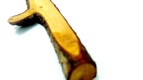 Close-up of bananas against white background