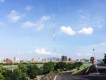 Cityscape against cloudy sky