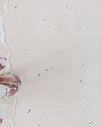 Low section of woman standing on floor