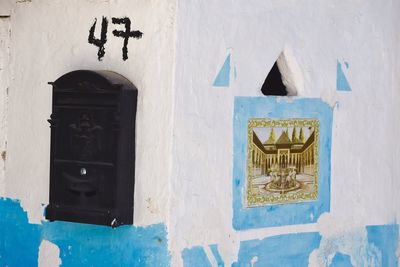 Old-fashioned mailbox on wall of building