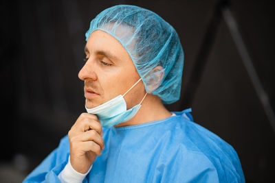 Doctor wearing surgical cap and mask
