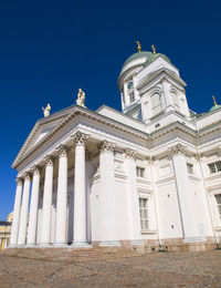 Low angle view of building against clear blue sky