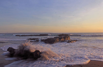 Scenic view of sea against sky during sunset