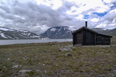 Scenic view of mountains against cloudy sky