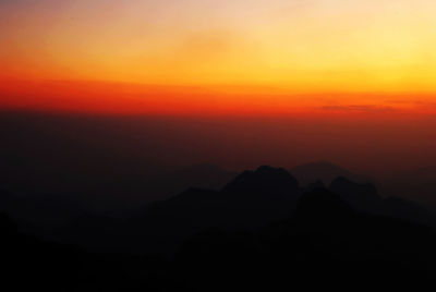 Scenic view of mountains at sunset