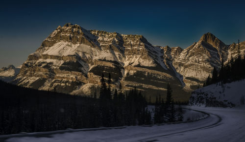 Scenic view of mountains against sky during winter