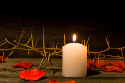 Close-up of illuminated lamp on table