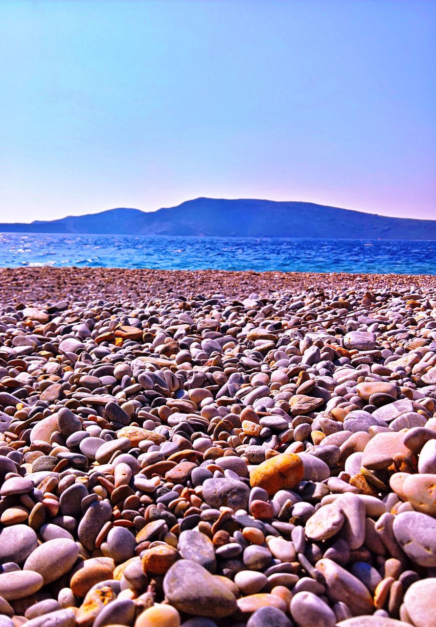 sky, beach, nature, beauty in nature, no people, pebble, water, scenics, day, mountain, outdoors, pebble beach