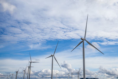 Low angle view of wind turbine against sky