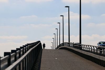 Footbridge against sky