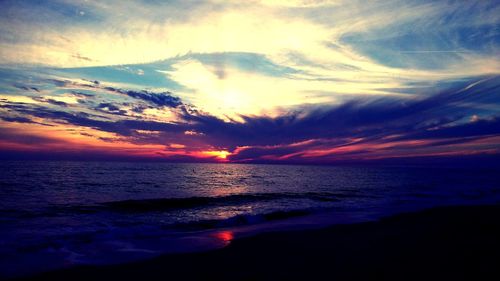 Scenic view of sea against dramatic sky