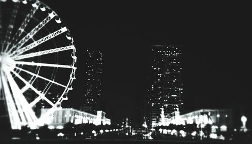 Low angle view of illuminated ferris wheel
