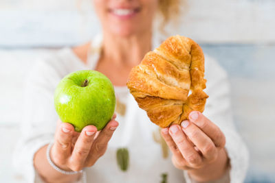 Close-up of woman holding fruit
