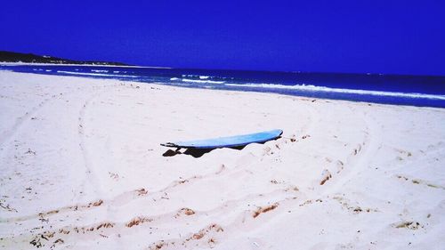 Scenic view of sea against clear blue sky