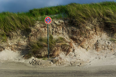 View of road sign against sky