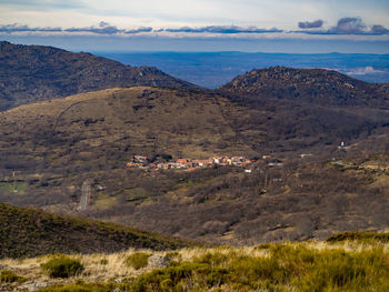 Scenic view of landscape and mountains against sky