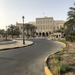 Arab architecture and palm trees. manama, bahrain