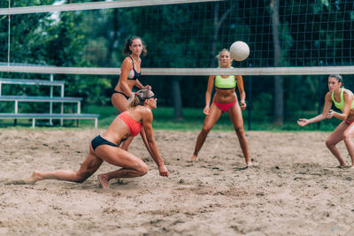 Beach volleyball player hitting the ball