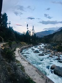 Scenic view of stream against sky