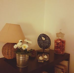 Flower vase on table at home