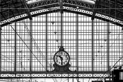 Low angle view of clock on ceiling at railroad station