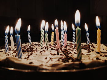 Burning candles on birthday cake
