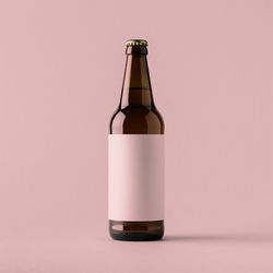 Close-up of glass bottle against white background