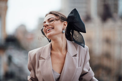 Smiling young woman looking away outdoors