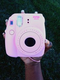 Close-up of hand holding mannequin