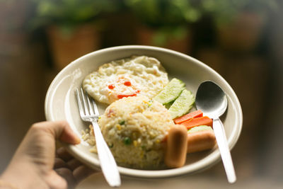 Close-up of person holding food