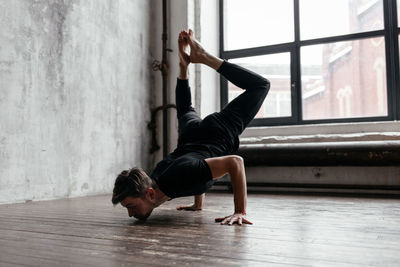 A man engaged in yoga and meditation, performing asanas