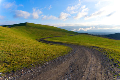 Scenic view of mountain road against sky