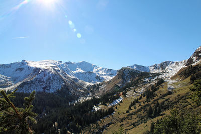 Scenic view of snowcapped mountains against sky