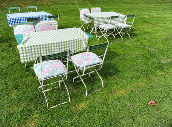 High angle view of empty chairs in park