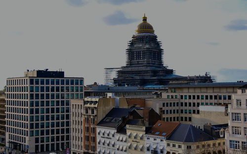 View of buildings in city against sky