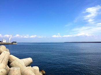 Scenic view of sea against blue sky