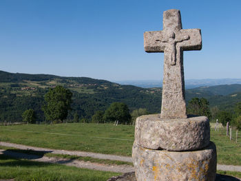 Old christian cross in the countryside
