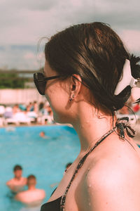 Side view of young woman swimming in sea