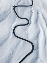 Aerial view of curvy asphalt road in the dolomites,italy.majestic  nature landscape. winter season.