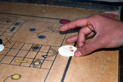 High angle view of person playing on table