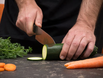 Midsection of man preparing food